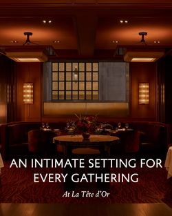 Dimly lit dining area with plush seating and elegant wood paneling at La Tête d'Or by Daniel.