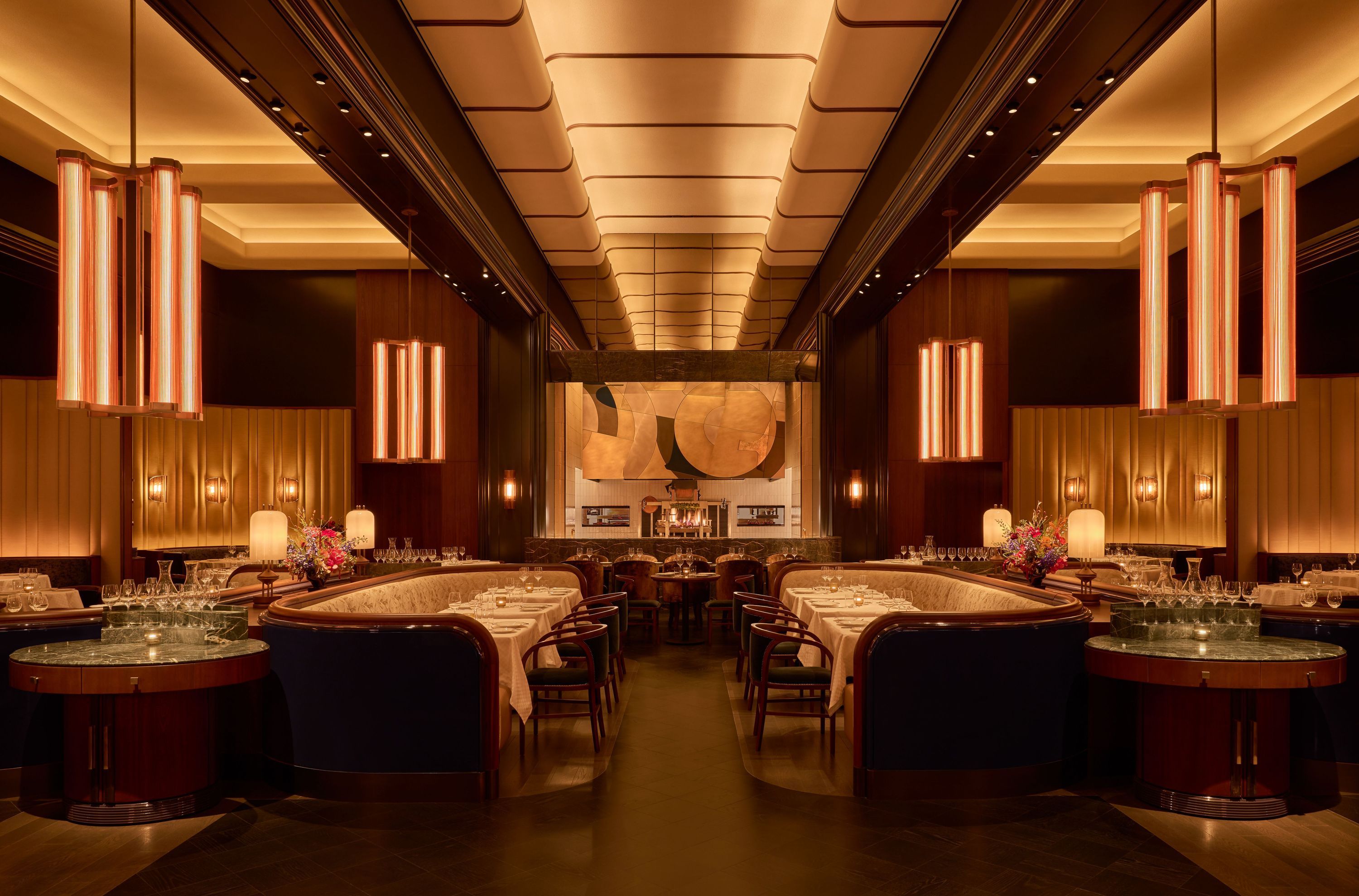 Elegant interior of La Tête d'Or by Daniel featuring stylish lighting and cozy seating arrangements.